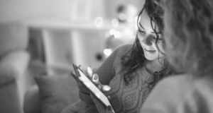 Young woman viewing mobile device screen